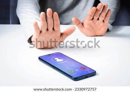 Debtor refusal to accept incoming call from creditor on smartphone. Financial or debt concept.