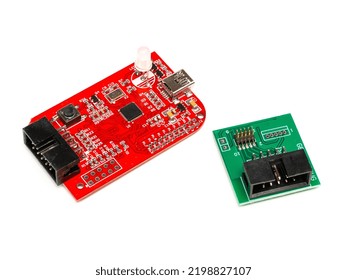 Debugger flasher board with a usb port for program chips and memory, with green adapter. Isolated on a white background.