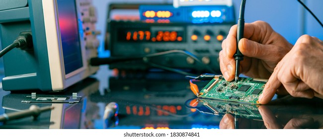 Debugging electronics device. PCB witch microcontroller in electronics laboratory - Shutterstock ID 1830874841