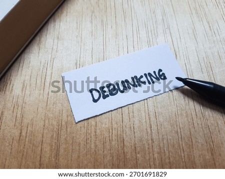 Debunking writting on table background.