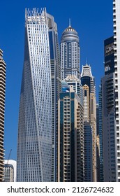 Dec 05 2021 - Dubai, UAE: View Of Dubai Marina Skyscrapers Shot From Below In Portrait Mode With Clear Blue Sky. 