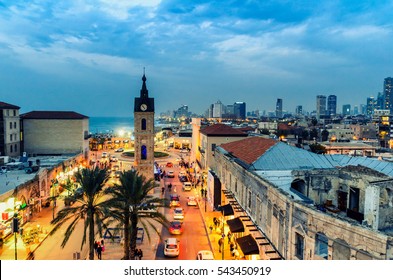 DEC 23, 2016 -  Top view on Jaffa, Israel. Clock tower and the main street at sunset. Tel Aviv skyline.