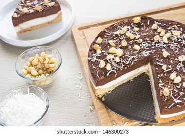 A Decadent Haupia And Chocolate Custard Pie Topped With Shaved Coconut, Macadamia Nuts And Shaved Chocolate