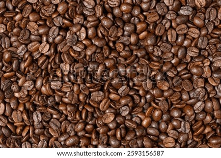 Decaffeinated coffee beans roasted close up top view