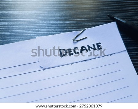 Decane writting on table background. 