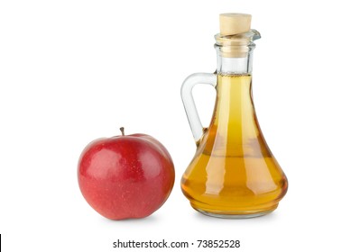 Decanter with apple vinegar and red apple  isolated on the white background