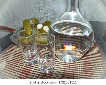 Decanter Of Vodka With Shot Glasses And Pickles. Gorgeous Home Appetizer Under A Glass Of Vodka. Natural Food, Appetizer. Closeup. Blurred Focus.