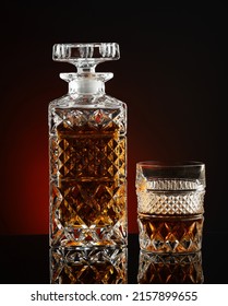 Decanter With Whiskey Or Cognac And Glass On Black Background