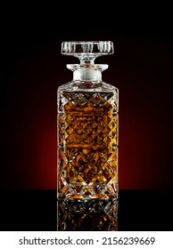 Decanter With Whiskey Or Cognac On A Black Background