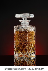 Decanter With Whiskey Or Cognac On A Black Background