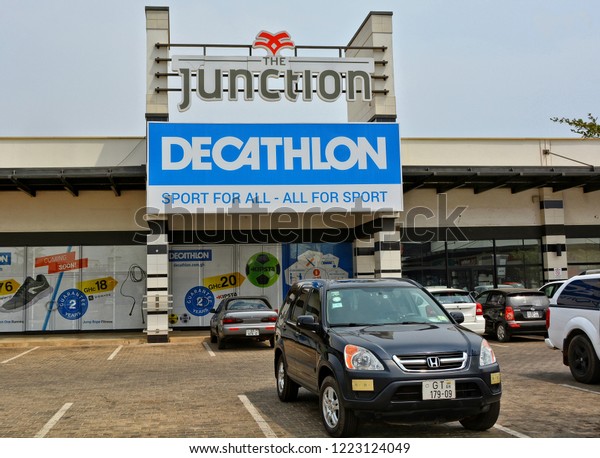 Decathlon store. French sporting goods retailer, the\
largest in the world. Shopping mall in Accra. Active style. Cars.\
Development of marketing in West Africa. Ghana, Accra – January 20,\
2017 