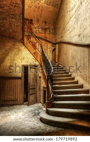 Decaying staircase in an abandoned central office