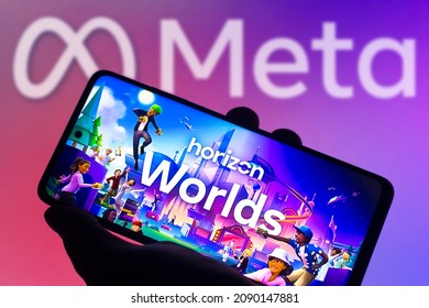 December 14, 2021, Brazil. In this photo illustration the Horizon Worlds logo seen displayed on a smartphone and in the background the Meta Platforms logo