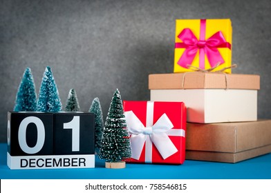 December 1st. Image 1 day of december month, calendar at christmas and new year background with gifts and little Christmas tree - Powered by Shutterstock