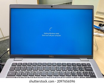 December 20, 2021 Bangkok. Dell Laptop Screen Show Windows Update Progress; After An IT Support Provide Security Patch On It. 