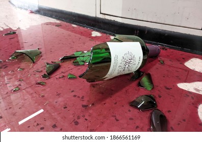 December 2020, Swansea, UK.
A Bottle of Merlot Red Wine Broken and Spilled on the Floor
Tesco Shop