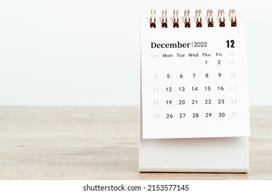 The December 2022 desk calendar on wooden background. - Shutterstock ID 2153577145