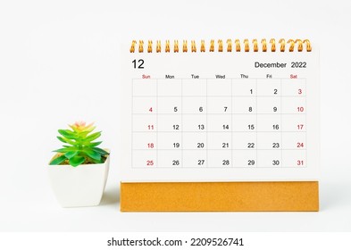 December 2022 Monthly desk calendar for 2022 year with plant pot isolated on white background. - Shutterstock ID 2209526741