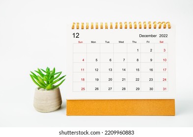 December 2022 Monthly desk calendar for 2022 year with plant pot isolated on white background. - Shutterstock ID 2209960883
