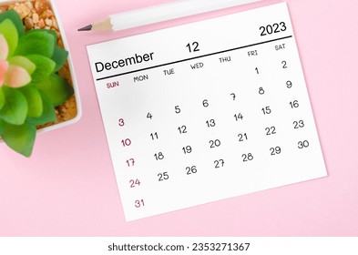 December 2023 Monthly calendar for 2023 year on pink background. - Shutterstock ID 2353271367