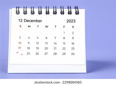 December 2023 Monthly desk calendar for 2023 year on purple background. - Shutterstock ID 2298004585