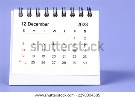 December 2023 Monthly desk calendar for 2023 year on purple background.