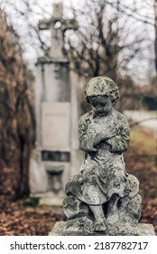 December, 26, 2017 - Vienna, Austria. Abandoned Cemetery Tomb With Child Statue, Close View. Old European Cemetery Baby Grave Sculpture, Gravestone In Saint Marx Cemetery.