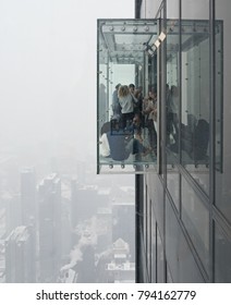 December 29, 2017, Chicago, Illinois, USA. People In The Glass Cube Of The Willis Tower Skydeck