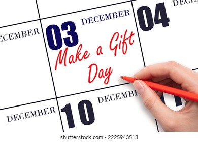 December 3rd. Hand writing text Make a Gift Day on calendar date. Save the date. Holiday.  Day of the year concept. - Shutterstock ID 2225943513