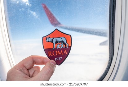 December 6, 2021. Rome, Italy. The Emblem Of The Football Club A.S. Roma On The Background Of The Airplane Window.