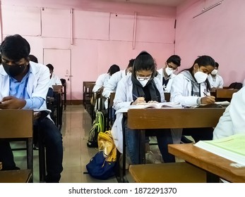 December 8, 2020. Uttar Pradesh, India. Medical Students In Mask And White Coat Giving Exam As Classes Reopen After Covid 19 Lockdown In Radheshwam Medical College, Uttar Pradesh,India.