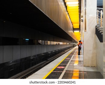 December 8, 2021. Moscow. Russia. A Lone Passenger On The Empty Platform Of The Novatorskaya Subway Station Is Waiting For The Train. Launch Of The Big Circle Line Of The Moscow Metro.