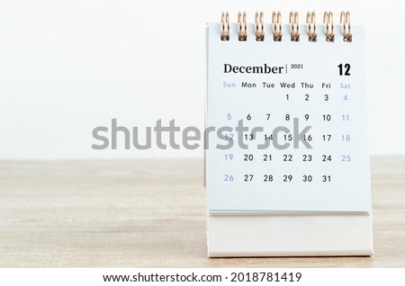 December Calendar 2021 on wooden table background.