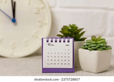 December calendar for 2023 on a colored background .Planning for every day. - Shutterstock ID 2375728857