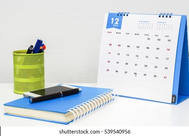 December Calendar On Office Desk Ready For Appointment And Business Meeting