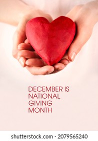 December is National Giving Month stock images. Female hands giving red heart stock photo. Red heart in female hands stock images