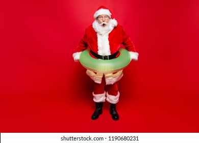 December noel eve sale discount pool party. Full legs body size aged mature grandfather funny Santa tradition costume headwear spectacles white beard isolated red background open mouth staring eyes - Powered by Shutterstock