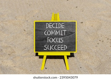 Decide commit focus succeed symbol. Concept word Decide Commit Focus Succeed on beautiful blackboard. Beautiful sand beach background. Business decide commit focus succeed concept. Copy space. - Shutterstock ID 2395043079