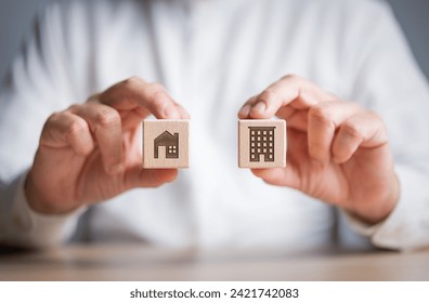Deciding between a house or condominium, mansion, apartment icon to choose the best property you want. Choose place to live that suits your lifestyle. Real estate and property decision making concept.