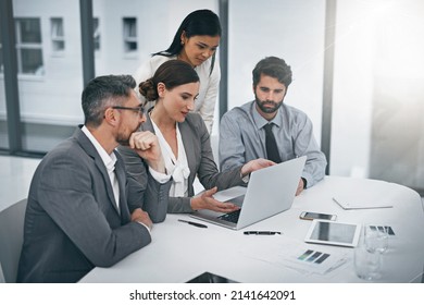 Deciding On The Best Way Forward. Shot Of A Group Of Businesspeople Meeting In The Boardroom.