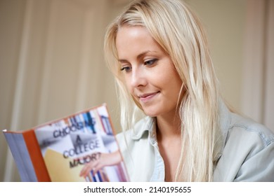 Deciding on her college major. A pretty young woman gathering advice on which subject to study as her major.