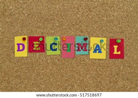 Decimal word written on colorful sticky notes pinned on cork board.