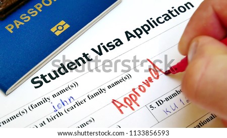 The decision to grant a visa. Pen voting approved in checkbox in blank Student Visa application form with passport and pen. Document with passport, apply and permission for foreigner country