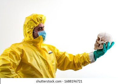 The Decision To Let Live Or Let Die, Moral Dilemma And Life Or Death Judgement Concept With Doctor In Hazmat Suit Holding A Human Skull Isolated On White Background With Clipping Path Cutout