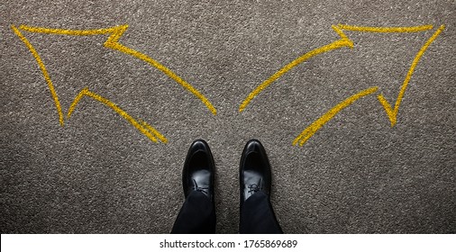 Decision In Life Or Business Concept. Businessman Standing On The Left And Right Arrow Direction. Split Road. Top View 