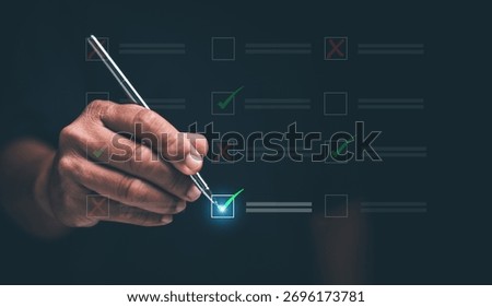 Decision making and task management concept. Hand holding stylus to check digital boxes with green and red marks. Representing planning, evaluation, progress tracking and successful completion.