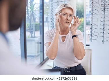 Decision, optometry and woman with glasses from an optometrist for vision, shopping and consultation. Exam, optician and senior patient fitting eyeglasses for visual improvement and frame choice - Powered by Shutterstock