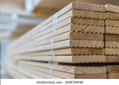 Deck Board Made Of Solid Wood In A Stack. Construction Industry. For Construction And Finishing Works. Sale Of Building Materials.