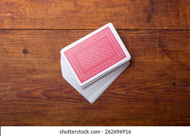 Deck Of Cards On Wooden Table