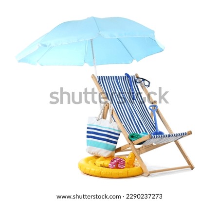 Deck chair, blue umbrella and beach accessories isolated on white background
